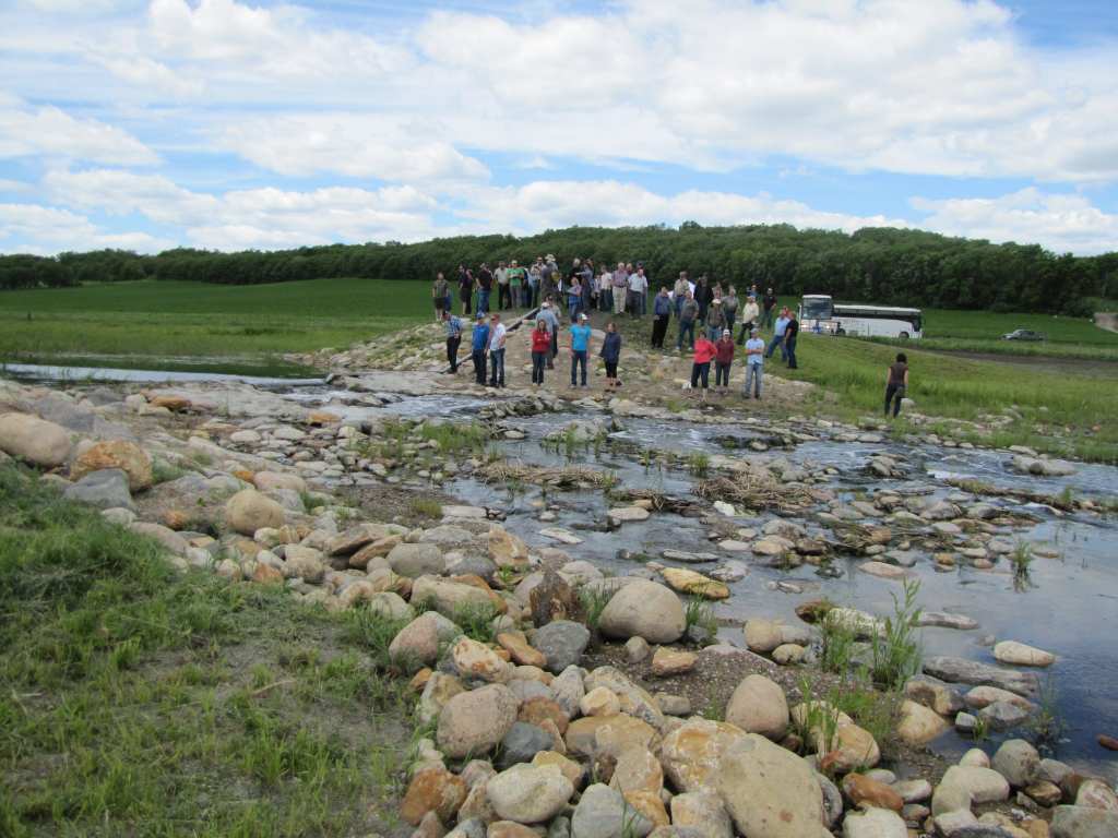 Tour visiting Pelly's Lake Dam